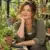 Mara Ellis at a greenhouse potting bench